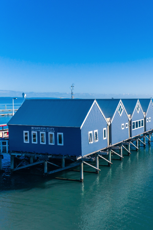 Photo of Busselton jetty, with visitors centre,  overlooking blue ocean on sunny day